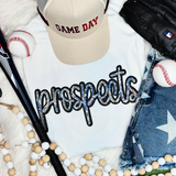 Prospects Sequin Patch, sparkling embroidered patch with colorful sequins spelling 'prospects' on a white fabric background surrounded by baseballs, a baseball bat, a cap, jeans, and jewelry.