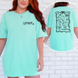Whimsical Amen SET DTF Heat Transfer, a graphic design on a light blue T-shirt featuring various whimsical illustrations and the word 'amen'.