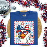 Patriotic Goose With Bow DTF Heat Transfer, colorful image of a cartoon goose wearing patriotic accessories and holding an American flag, surrounded by red, white, and blue party decorations.