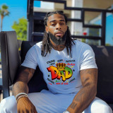 DAD Strong Hero Dope Protector Black Provider Man Of God Leader DTF Heat Transfer, a man wearing a white T-shirt featuring vibrant colorful text and graphics including a crown and the word "DAD" on the front.