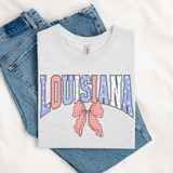Shabby Patriotic Bow - Pick Your State DTF Heat Transfer, graphic design with patriotic red, white, and blue colors, stars, and checkered bow on a T-shirt.