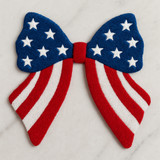 Patriotic Coquette Bow Fluffy Patch, a colorful bow featuring a blue top with white stars and red and white striped tails, ideal for patriotic celebrations.