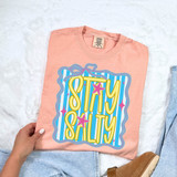 Stay Salty Starfish Coquette DTF Heat Transfer, colorful graphic design on a peach-colored t-shirt featuring starfish and striped background.
