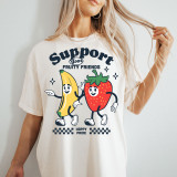 Support Your Fruity Friends DTF Heat Transfer, a cheerful graphic design featuring animated banana and strawberry characters with text.