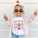 Retro Back To School Coquette Bows DTF Heat Transfer, a young girl wearing sunglasses and a pink headband with bow, showing peace signs, with a school-themed graphic t-shirt and a light pink jacket.