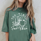 Too Tired For This WHITE DTF Heat Transfer, graphic design of a person with a towel over their head and a coffee mug with the caption 'Too Tired For This' on a green t-shirt.