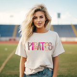 Preppy Leopard Mascot DTF Heat Transfer, a vibrant pink and leopard print design spelling 'PIRATES' on a white t-shirt worn by a young woman on a sports field.