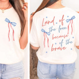 Land Of The Free Because Of The Brave Bows SET DTF Heat Transfer, white T-shirt with patriotic design featuring blue bows with red and white stripes and the phrase 'Land Of The Free Because Of The Brave' printed on the back in red and blue lettering.