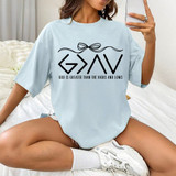God Is Greater Bow DTF Heat Transfer, woman wearing a light blue T-shirt with a black Christian-themed design and slogan