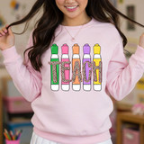 Teach Leopard Markers DTF Heat Transfer, colorful markers spelling out 'TEACH' with leopard print design on the letters.
