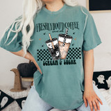 Freshly Boo'd Coffee DTF Heat Transfer, design on a teal t-shirt featuring two illustrated cups of coffee with spooky ghost and spider web decorations, perfect for Halloween or coffee lovers.