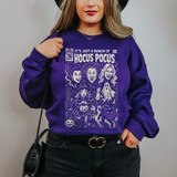 Bunch of HP White DTF Heat Transfer, Halloween-themed illustrated design on a purple sweatshirt featuring witches, ghosts, a black cat, and spooky elements.