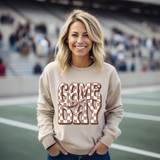 Brown Checker Game Day Coquette DTF Heat Transfer, a woman wearing a sweatshirt with a Game Day design on a sports field.
