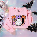 Retro Boo Ghost & Bows DTF Heat Transfer, Halloween-themed ghost and bows design on pink sweatshirt with black and white checkered details, surrounded by Halloween decorations.