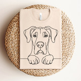 Dog Doodles DTF Heat Transfer, minimalist line art of a dog with paws on a surface.