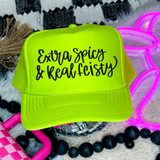 Extra Spicy & Real Feisty DTF Heat Transfer, fluorescent yellow trucker hat with black text, vibrant and eye-catching design.