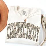 Camo States DTF Heat Transfer, a printed camouflage pattern text on a white t-shirt.