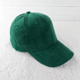 Evergreen Corduroy Hat, green corduroy baseball cap with a curved brim and button on top.