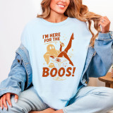 I'm Here For The Boos DTF Heat Transfer, humorous Halloween-themed shirt design featuring a ghost in a cocktail glass and a cat, with bold text and playful graphics.