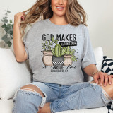 Product God Makes All Things Grow DTF Heat Transfer, a colorful illustration of potted plants including a cactus, with inspirational biblical quote on a gray t-shirt.