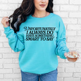 Unfortunately I Always Do Have Something Smart To Say DTF Heat Transfer, a woman wearing a blue sweatshirt with a quote printed on it, holding a glass of wine, standing against a white brick wall.