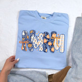 Coquette Fall Names DTF Heat Transfer, colorful Halloween-themed graphic design on a light blue T-shirt with pumpkins, ghosts, and ribbons.