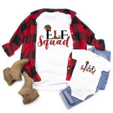 Elf Squad Glitter Effect Christmas Sublimation Transfer, Christmas themed clothing items with glittery elf hat and text design 'Elf Squad' on white shirts displayed with a red and black plaid shirt, jeans, and tan boots.