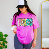 Toros Dalmatian Dots DTF Heat Transfer, colorful polka dot design on a pink t-shirt worn by a woman.