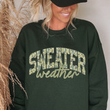 Sweater Weather Green Camo DTF Heat Transfer, a black sweatshirt with a green camouflage print of the words "SWEATER weather".