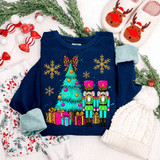 Nutcracker Christmas Tree Leopard Bow DTF Heat Transfer, colorful festive holiday design on a navy blue sweatshirt with Christmas decorations around.