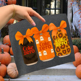 Cola Zero Halloween Cans DTF Heat Transfer, product design featuring three Halloween-themed Coke Zero cans with orange bows on a dark background.