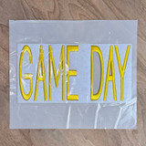 FLAWED Large Game Day PUFF Embroidered Patch - Various Colors, yellow embroidered patch with the words "GAME DAY" in large letters on a white background, in a clear plastic bag.