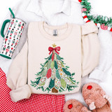 Patterned Patchwork Christmas Tree DTF Heat Transfer, a colorful Christmas tree design with patchwork patterns on a white sweatshirt.
