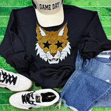 Golden Wildcat Starry Eyes Sequin Patch, a clothing item with a glittery gold and white wildcat face designed with star-shaped eyes.