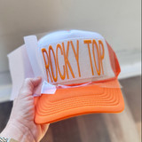 Rocky Top Orange Puff Embroidered HAT/POCKET Patch, image of a stylish orange and white cap with embroidered orange text 'ROCKY TOP' on the front panel.