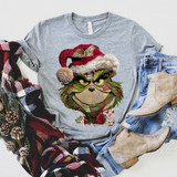 Grumpy Guy Faux Embroidery DTF Heat Transfer, embroidered holiday-themed Grinch character wearing a Santa hat on a gray sweatshirt.