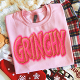 Grinchy Faux Patch DTF Heat Transfer, pink sweatshirt with embroidered Grinchy text design outlined with gold thread.