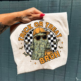 Trick Or Treat Bruh Camo Ghost DTF Heat Transfer, a graphic T-shirt featuring a ghost wearing sunglasses and a camo draped cloak, with Halloween-themed background elements.