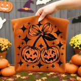 Pumpkin Cherries PUFF Orange/Flat Black Transfer, Halloween-themed design of two pumpkins with smiling faces and a bow on top, surrounded by stars and sparkles.