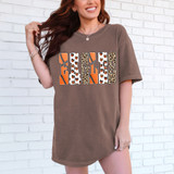 Eagles Basketball Pattern DTF Heat Transfer, a colorful pattern featuring basketball-themed designs with leopard and butterfly motifs applied on a t-shirt.