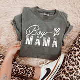Distressed Boy Mama WHITE DTF Heat Transfer, close-up of gray t-shirt with 'Boy Mama' design, person wearing leopard print pants and white Nike sneakers, on soft pink textured surface.