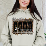 Leopard God Is Just So Good DTF Heat Transfer, person wearing a hoodie with biblical quote and leopard print design.
