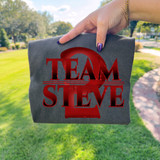 Team Steve ST DTF Heat Transfer, red heat transfer design on gray fabric.