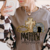 Matthew Twenty Eight Six DTF Heat Transfer, close-up of woman using a smartphone to showcase a religious-themed heat transfer design on her sweatshirt.