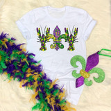 Paint splatter Fleur de lis crawdads Mardi Gras Sublimation Transfer, featuring colorful paint splatter crawdads and fleur de lis design on a white t-shirt with Mardi Gras themed feather accessories.