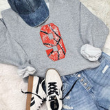 Basketball Number Sequin Patch, a red sequined patch shaped like the number 9 with black and white lines resembling a basketball on a gray sweatshirt.