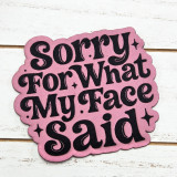 Sorry For What My Face Said FAUX Leather Patch, pink fabric patch with black embroidered text and decorative stars.