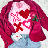 XOXO Fluffy Valentine's Day Patch, pink and red heart patches on a pink T-shirt layered under a pink blazer, complemented with a pink rose and a love card, for romantic Valentine's Day fashion.