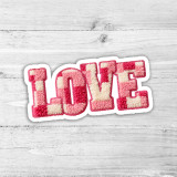 Faux Chenille Checkered LOVE Die Cut Sticker, pink and white checkered plush love word sticker on white wooden background.