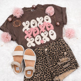 XOXO Fluffy Patch Muted Pinks T-shirt with pink fluffy patches and distressed leopard print shorts with sandals, fashion ensemble for casual wear.